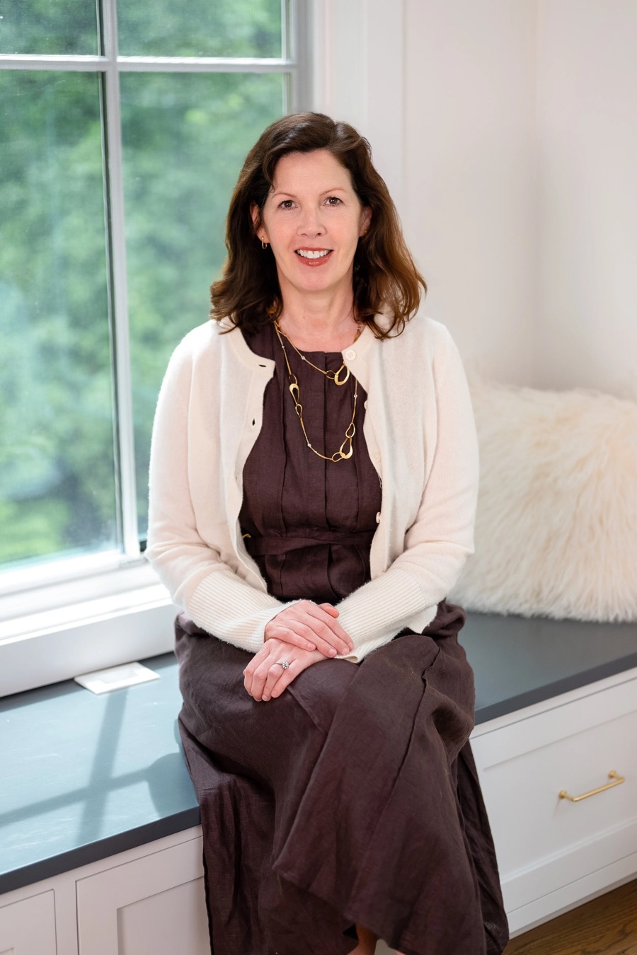 Dr. Jennifer Kelly seated by a window in her Rye office